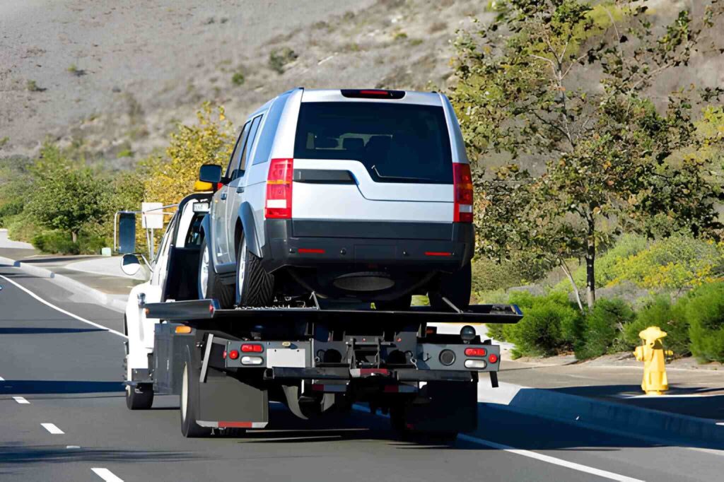 24/7 recovery near me tow truck helping a stranded vehicle