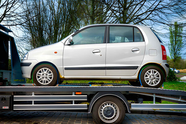 Tow truck rescuing a stranded car on a Dubai highway